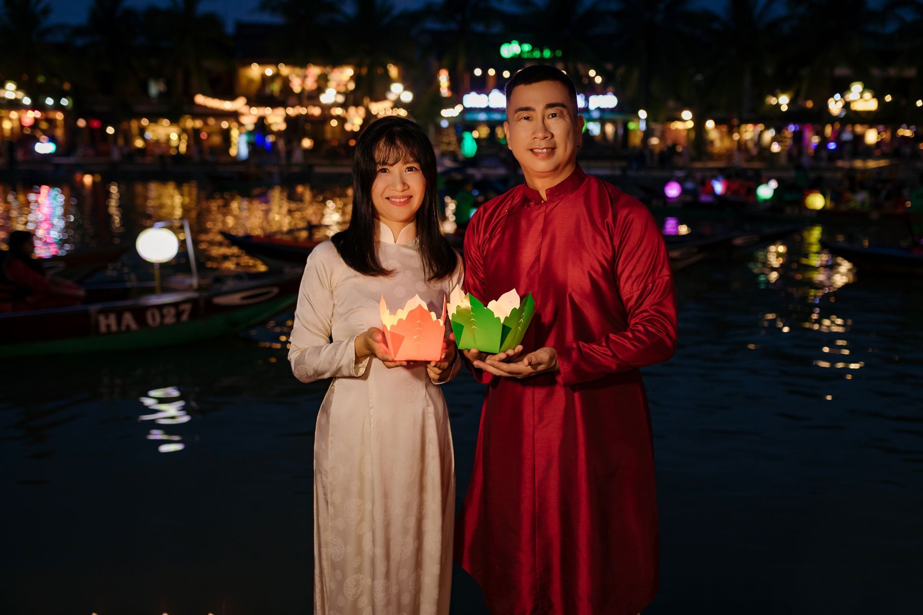 An Asian couple enjoying a lantern festival together.