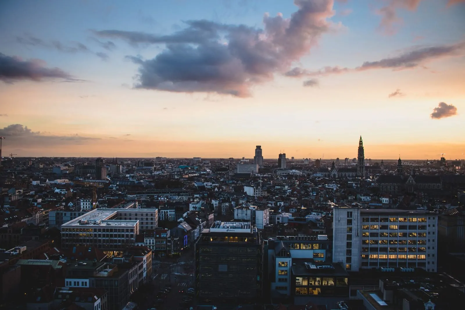A city skyline glowing at sunset.
