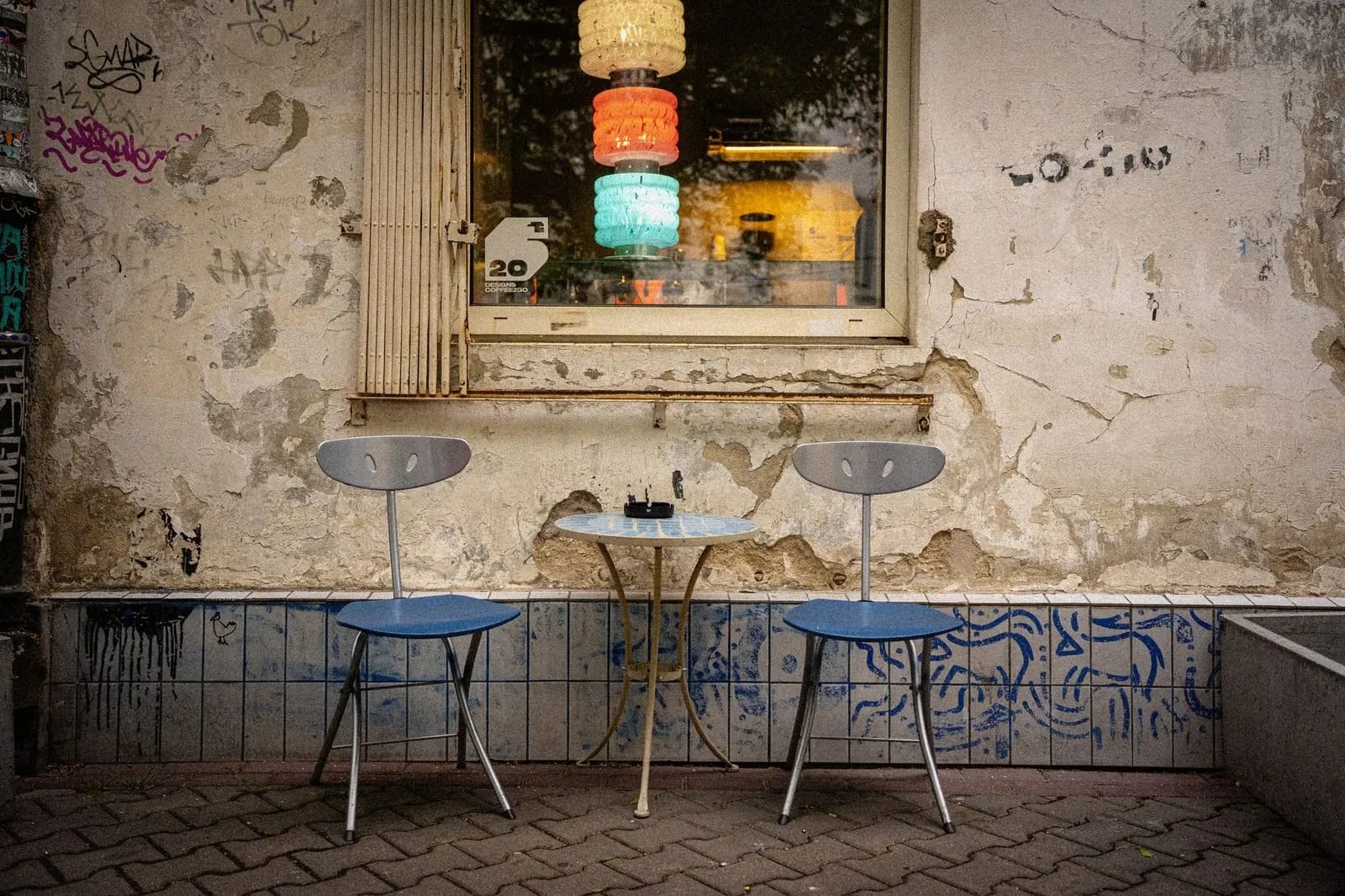 A quiet coffee shop table set for two, ready for a date.