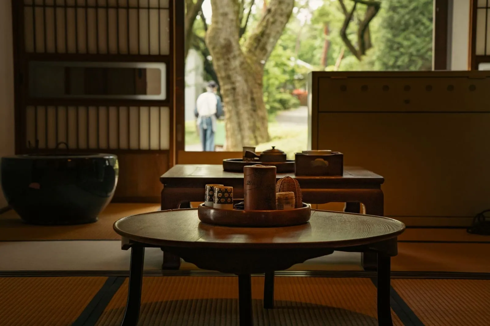 A warm living room prepared for a family conversation, with tea on the table.