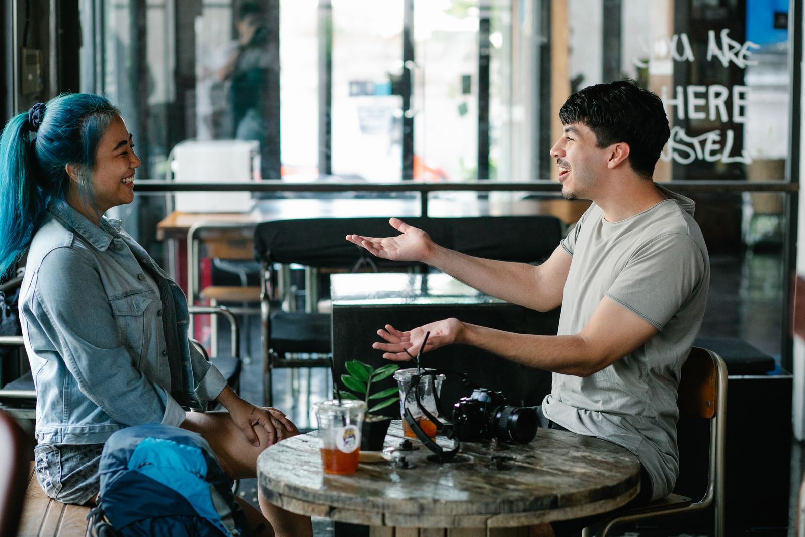 An intercultural couple talking over coffee at a café