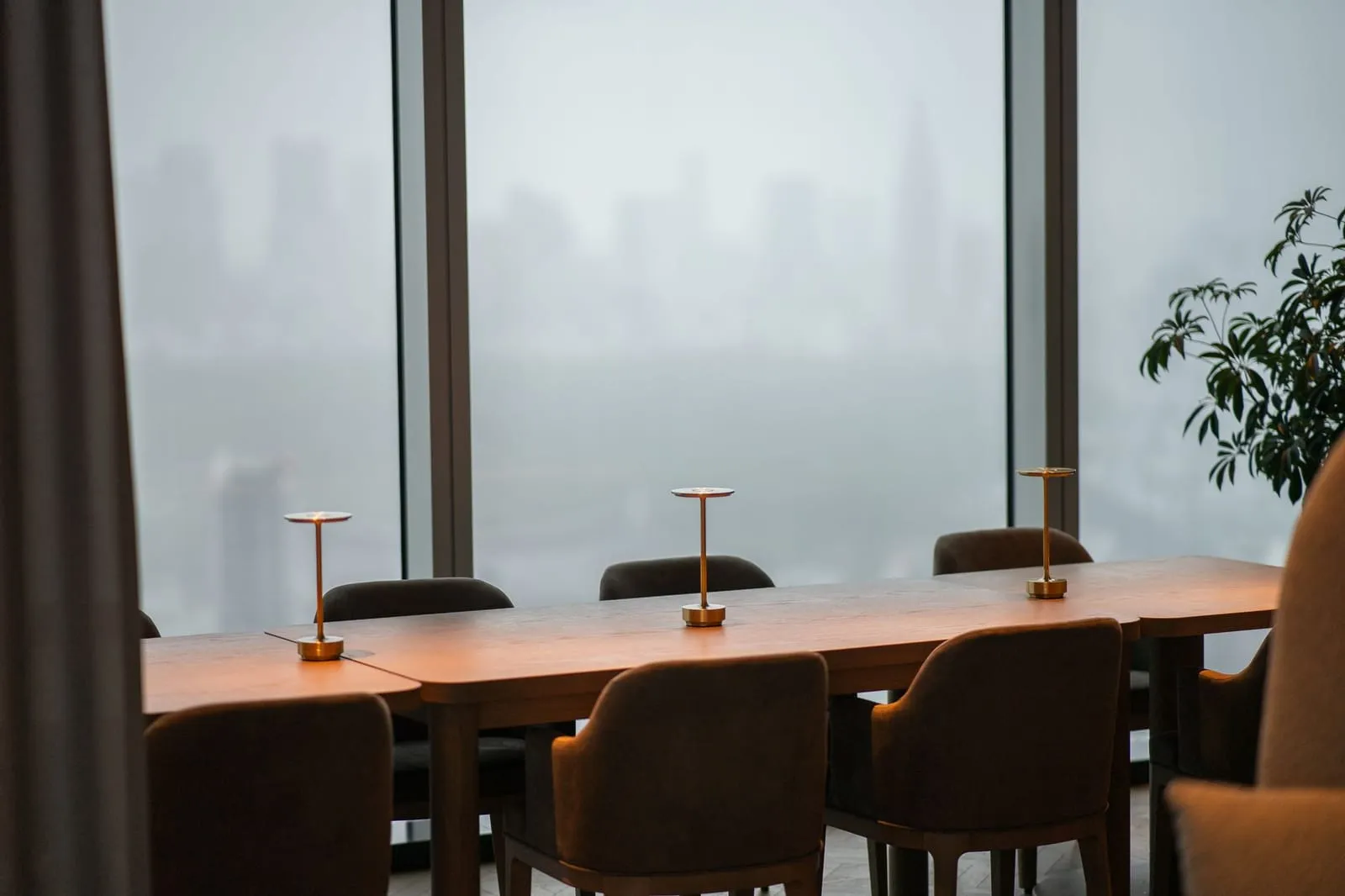 A cozy pan-Asian café with lanterns and city views, blending cultures.